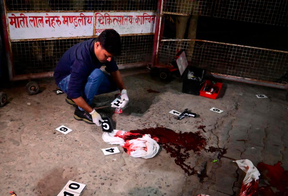 Indian ex-politician, brother shot dead live on TV