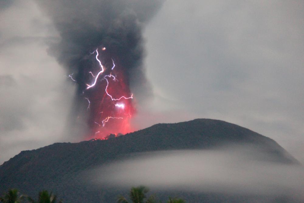 Indonesia’s Ibu volcano erupts twice, spewing red-hot lava