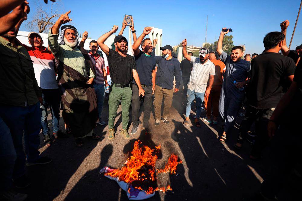 Iraqis breach Sweden mission as Muslim nations denounce Koran burning
