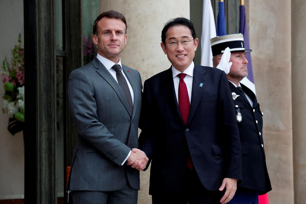 Kishida, Macron agree to start negotiations on new security pact