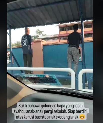 Malaysian fathers go to extremes to watch over their children on first day of school
