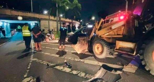 Man dies, three hurt after car crashes into backhoe Man dies, three hurt after car crashes into backhoe