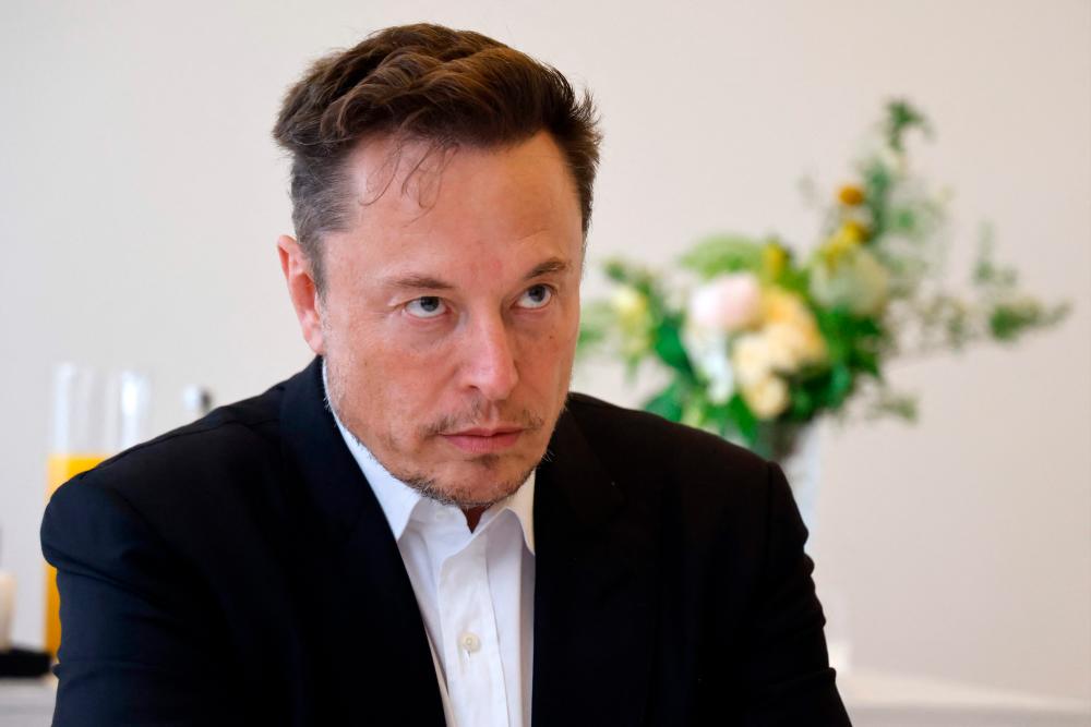 Musk warns of tough global economy, says Tesla not immune
