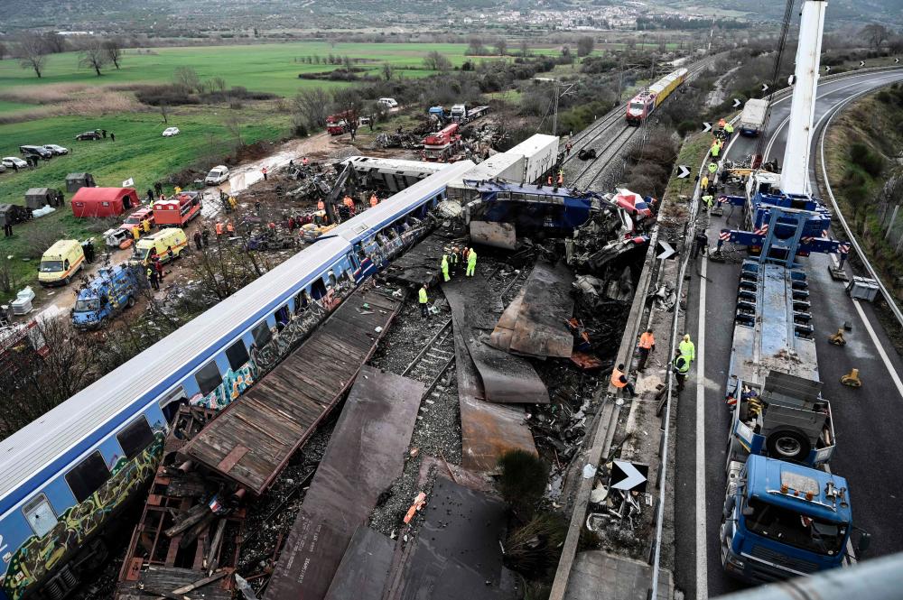 Police carry out search at Larissa station after Greek train crash Police carry out search at Larissa station after Greek train crash