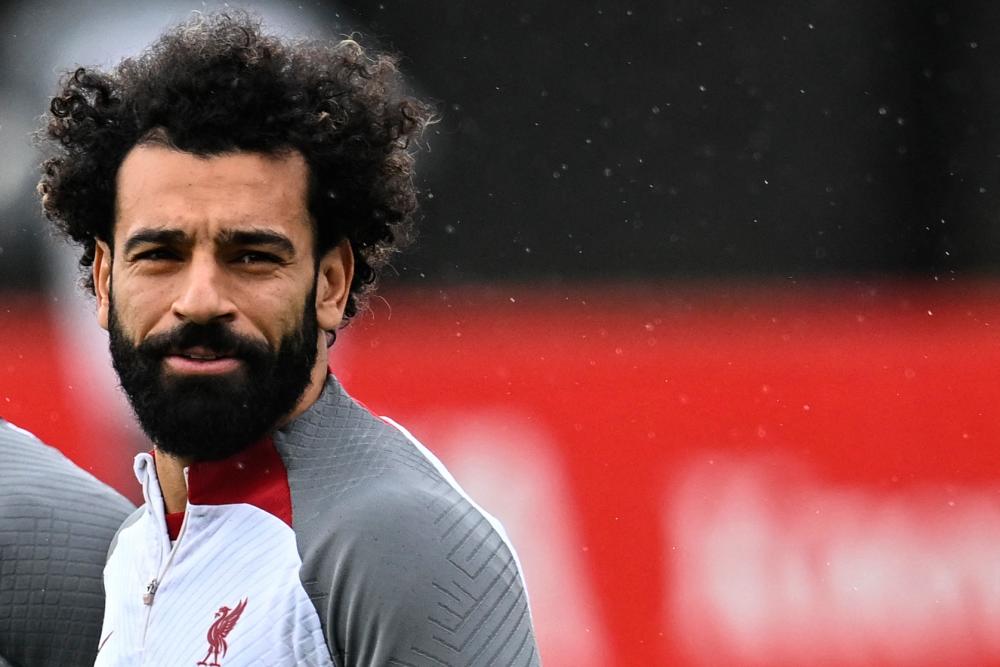 Police return a silver medal stolen from Salah's home in Cairo