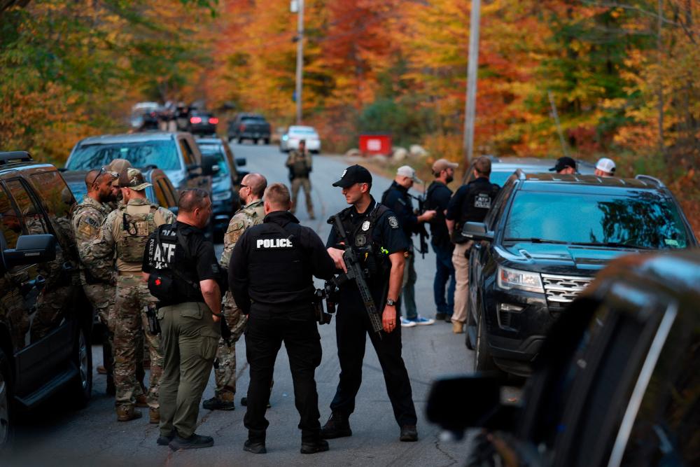 Police surround family home of ‘armed and dangerous’ US shooting suspect Police surround family home of ‘armed and dangerous’ US shooting suspect