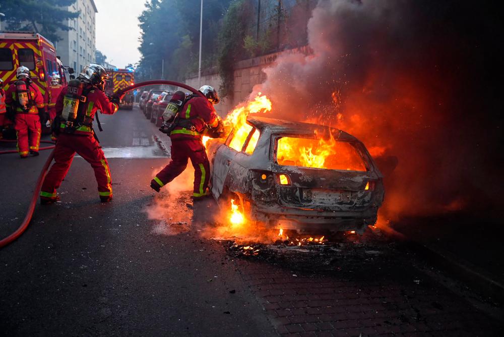 Protests flare up in France after police shoot teenager Protests flare up in France after police shoot teenager