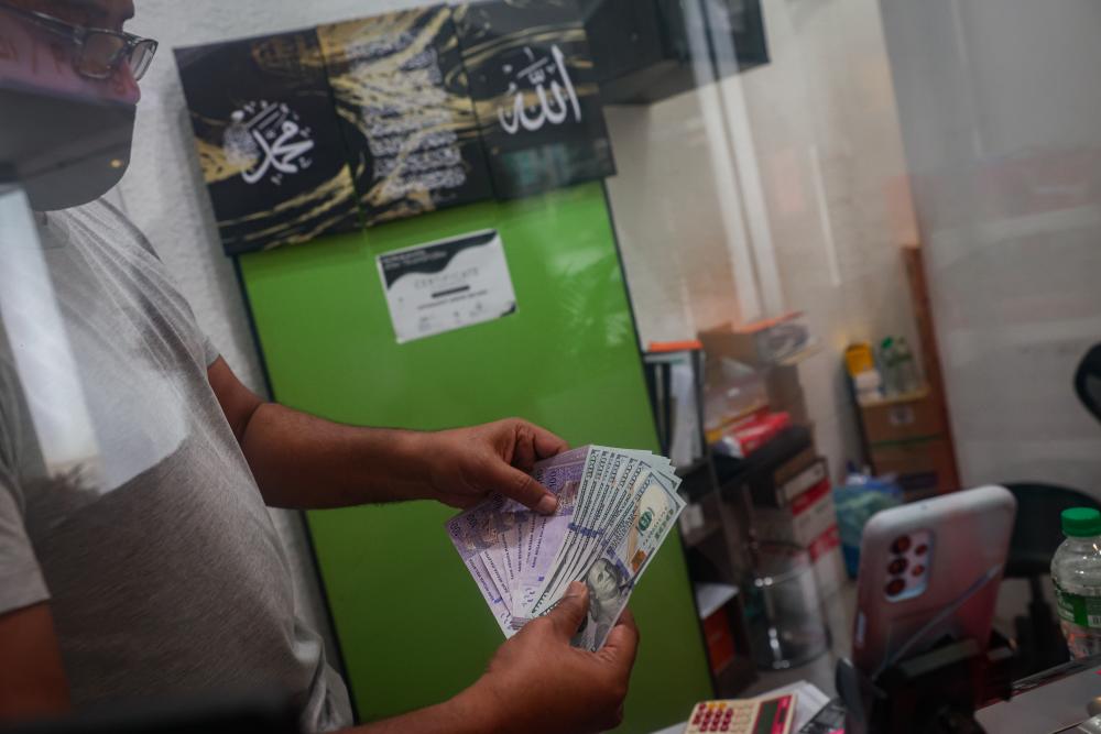 Ringgit ends lower against firm US dollar Ringgit ends lower against firm US dollar