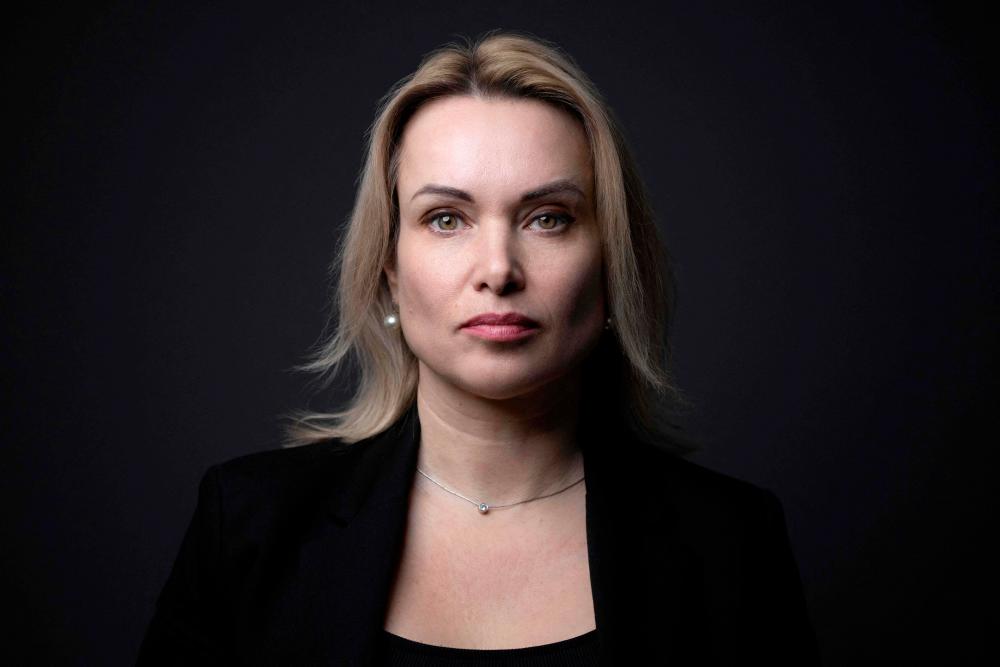 Russian reporter who staged TV protest handed jailed time in absentia Russian reporter who staged TV protest handed jailed time in absentia