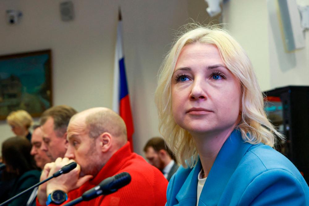 Russia’s election panel refuses to register Putin opponent
