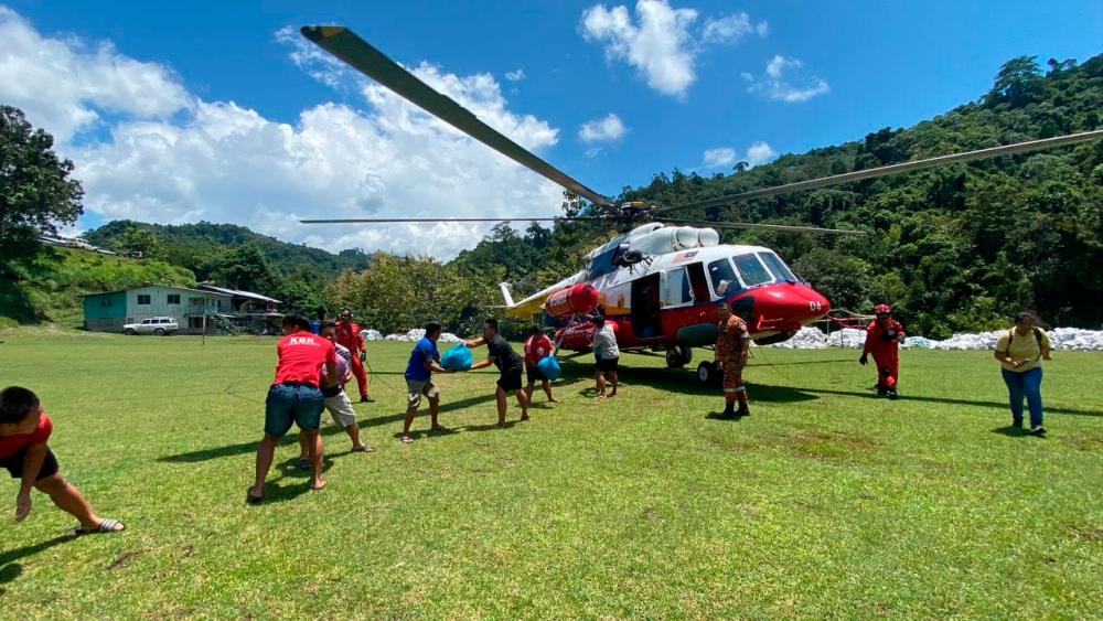 Sabah JBPM delivers food aid to villages cut off following landslide Sabah JBPM delivers food aid to villages cut off following landslide
