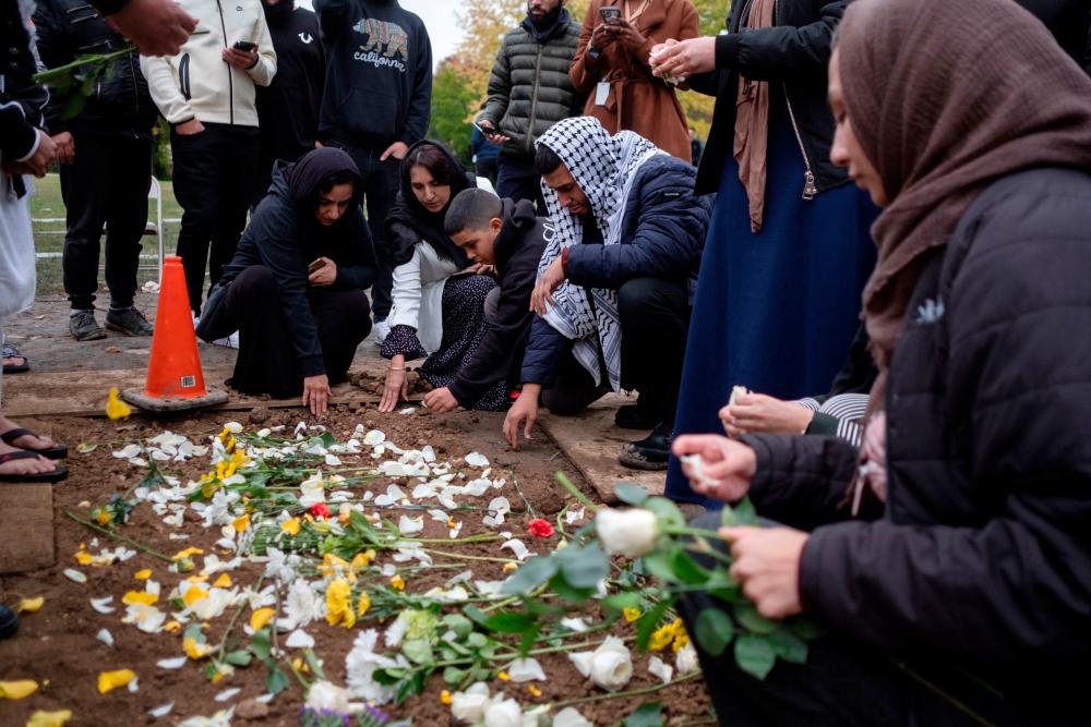 Slain Palestinian boy mourned in Illinois; suspect appears in court