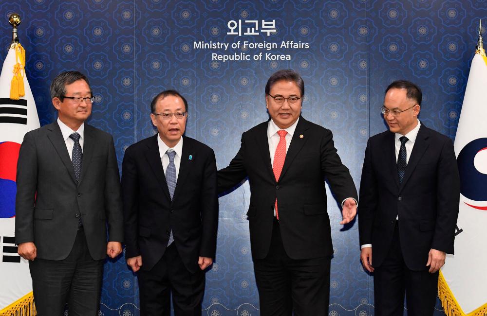 South Korea to host rare talks with Japan, China diplomats South Korea to host rare talks with Japan, China diplomats