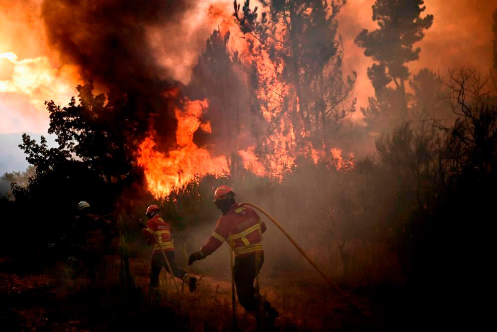 Spain says containing wildfire as conditions improve