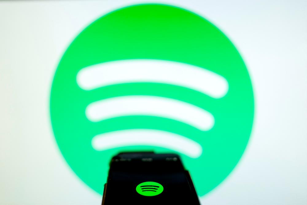 Spotify to axe about 1,600 jobs to cut cost