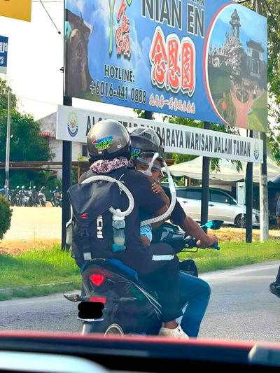 Struggling family of three riding motorcycle with baby on breathing aid gets PM’s attention Struggling family of three riding motorcycle with baby on breathing aid gets PM’s attention