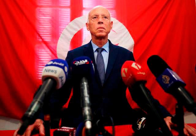 Tunisia detains cartoonist over drawings mocking PM Tunisia detains cartoonist over drawings mocking PM