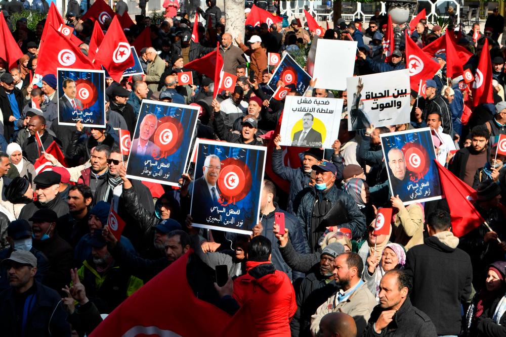 Tunisians defy protest ban to demand release of Saied critics Tunisians defy protest ban to demand release of Saied critics