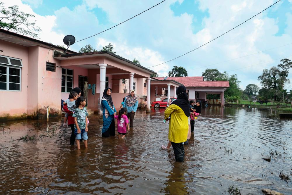 Villagers in Rawai forced to wade through stinky, stagnant floodwaters daily since last month Villagers in Rawai forced to wade through stinky, stagnant floodwaters daily since last month