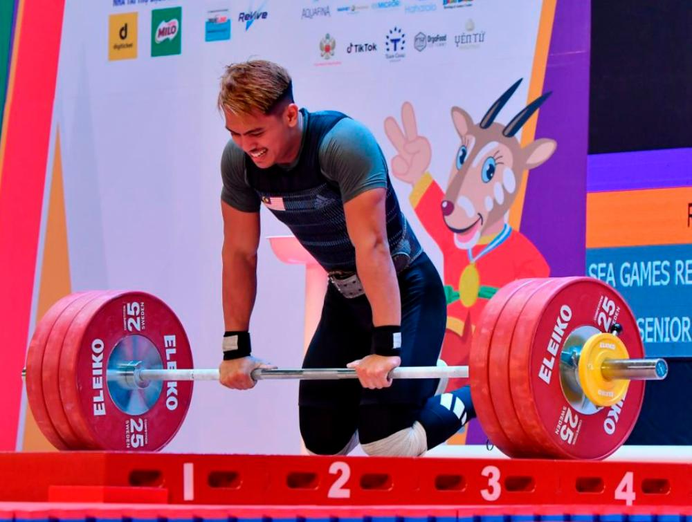 Weightlifter ready to battle on for medals despite injuries Weightlifter ready to battle on for medals despite injuries