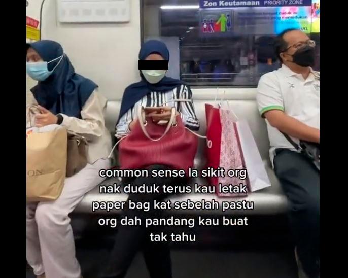 Woman caught hogging seat with shopping bags in crowded LRT
