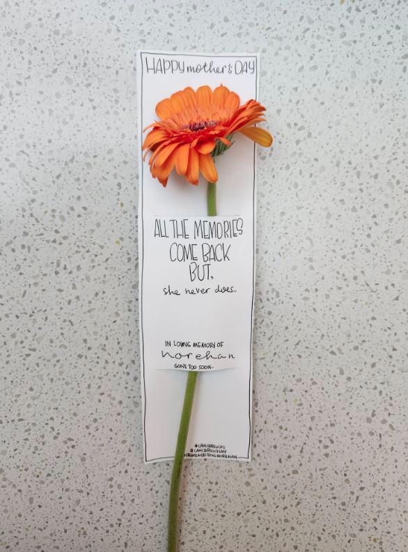 Woman hands out flowers to strangers on Mother’s Day in memory of late mother 