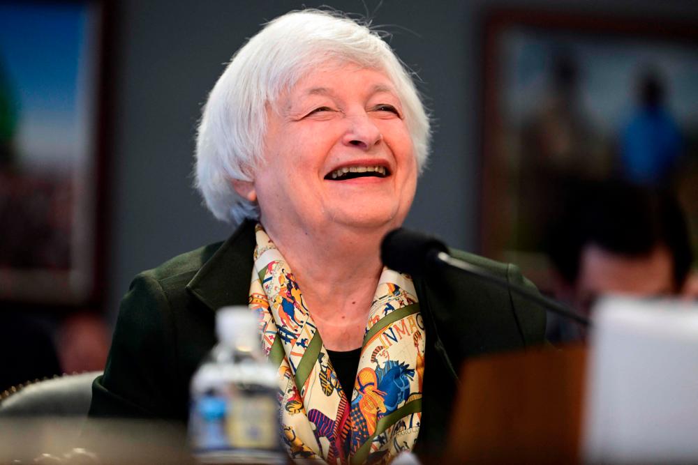 Yellen tries to assuage nervous investors as bank stocks slide