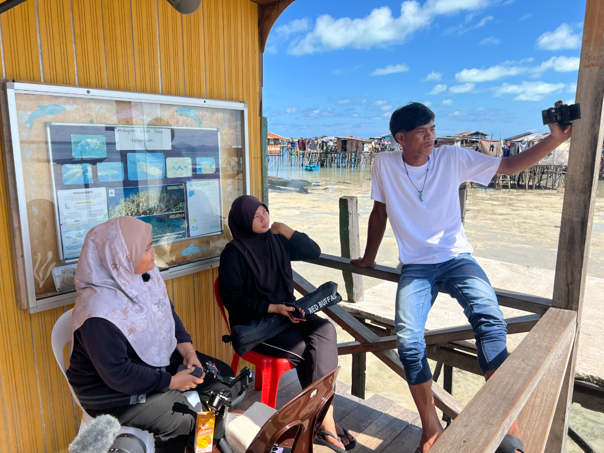From left: Didi, Shima and Bilkuin planning a shoot as part of Jom Kita Ke Laut.
