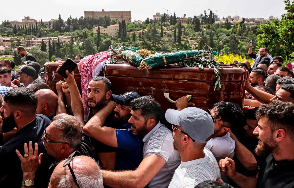 After outcry, Israel police to probe actions at journalist's funeral After outcry, Israel police to probe actions at journalist's funeral