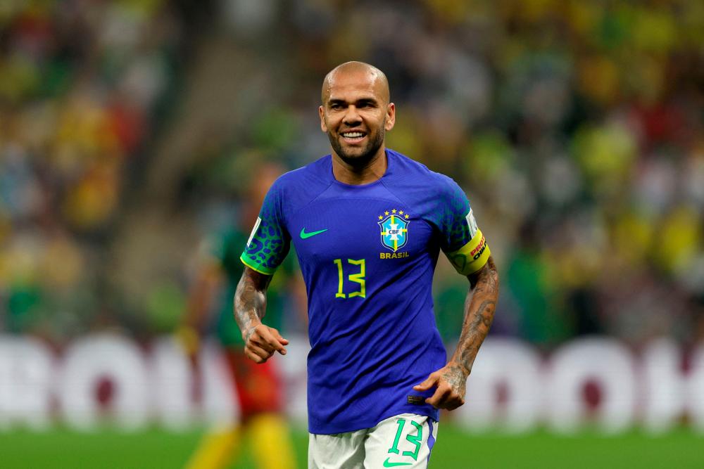 Alves sets Brazil record as World Cup favourites make nine changes