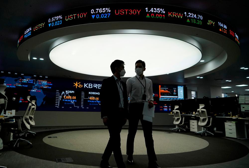 Asian shares jump to record high as investors bet on healthier 2021