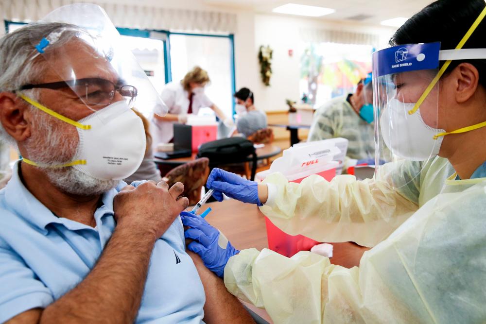 Biden plans accelerated release of Covid-19 vaccine to states as pandemic hits hard
