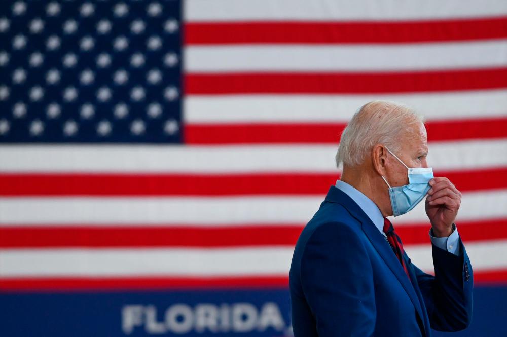 Biden slams Trump over reassuring remarks on Covid-19