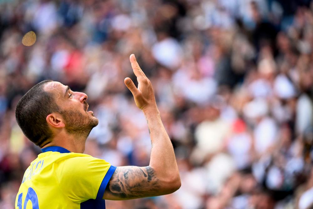 Birthday boy Bonucci puts Juve on brink of Champions League with brace