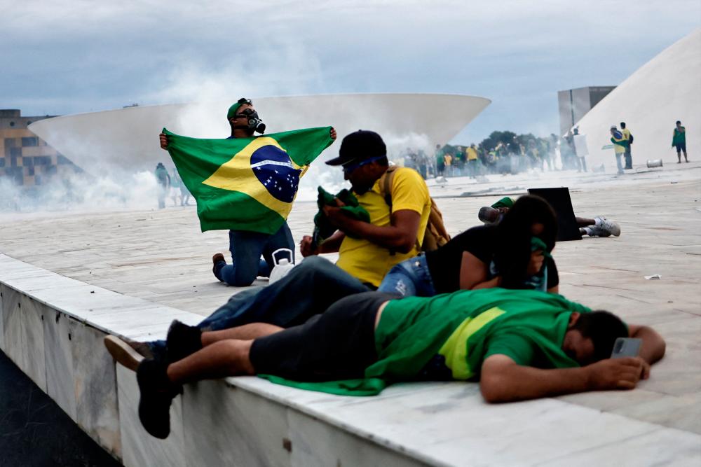 Bolsonaro’s Florida stay puts ball in Biden’s court after Brasilia riots