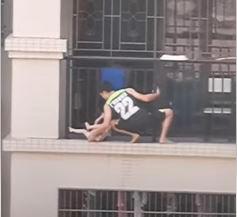 Brave neighbour scales 7th floor apartment building to rescue dangling toddler 