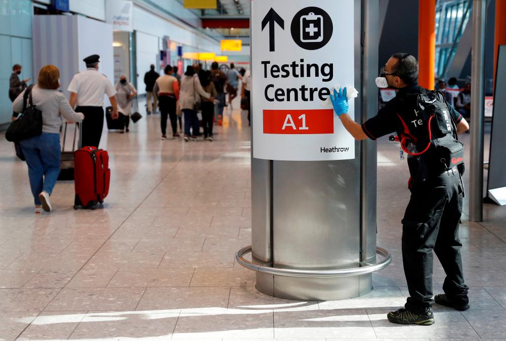 Britain cuts cost of health serviceâs Covid-19 travel tests
