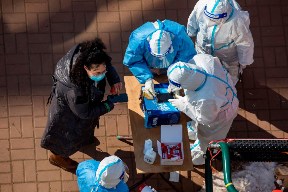 China locks down city of 9 million as virus ripples across country China locks down city of 9 million as virus ripples across country