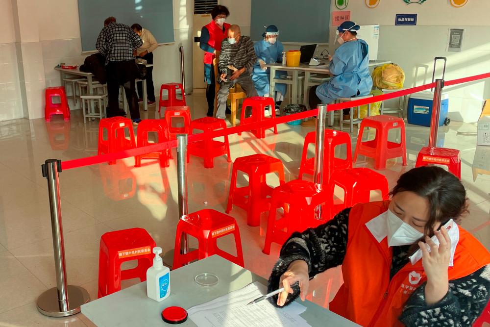 Chinese cities give out free fever drugs as Covid flares
