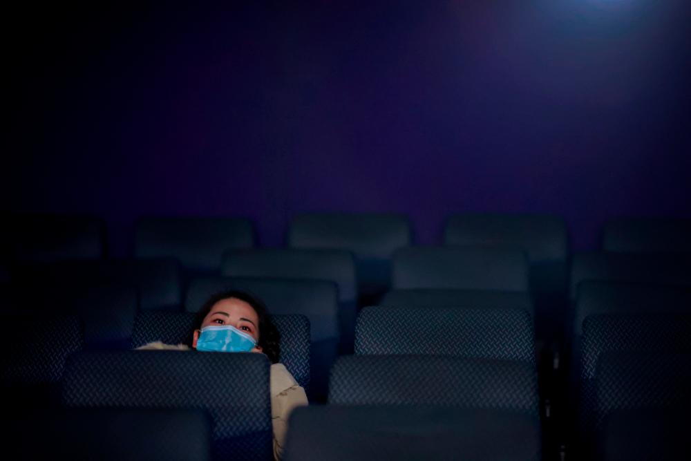 Chinese discouraged from Lunar New Year travel go to movies instead
