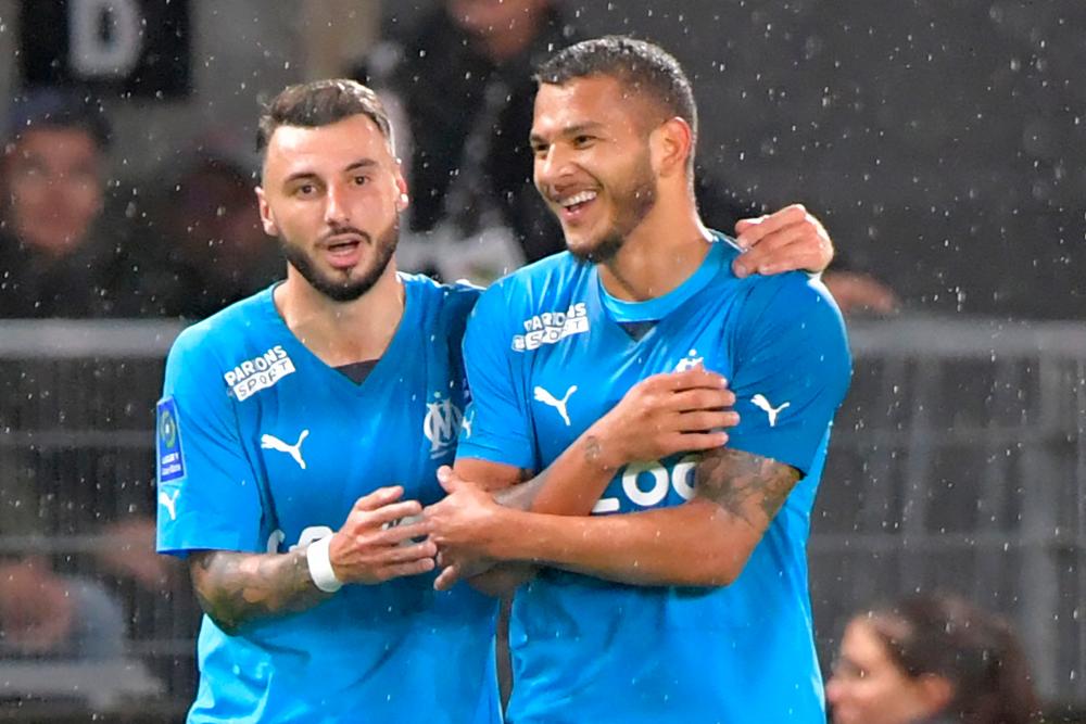 Clauss delivers as Marseille beat Angers climb to top of Ligue 1 Clauss delivers as Marseille beat Angers climb to top of Ligue 1