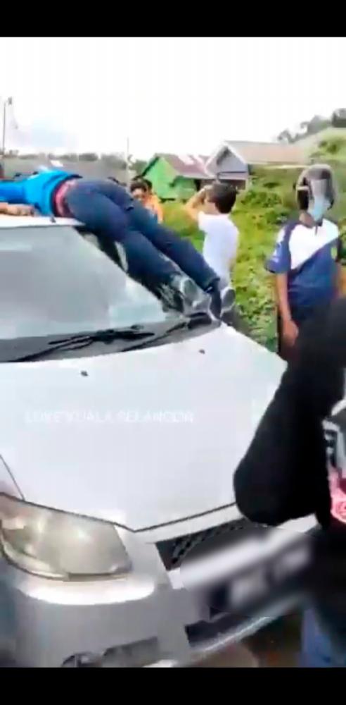 Elderly woman gets into hit-and-run accident, drives with corpse on car roof Elderly woman gets into hit-and-run accident, drives with corpse on car roof