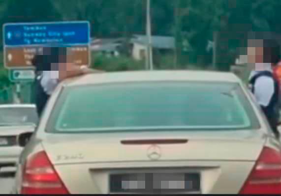 Father of kids seen sticking heads out of moving car charged