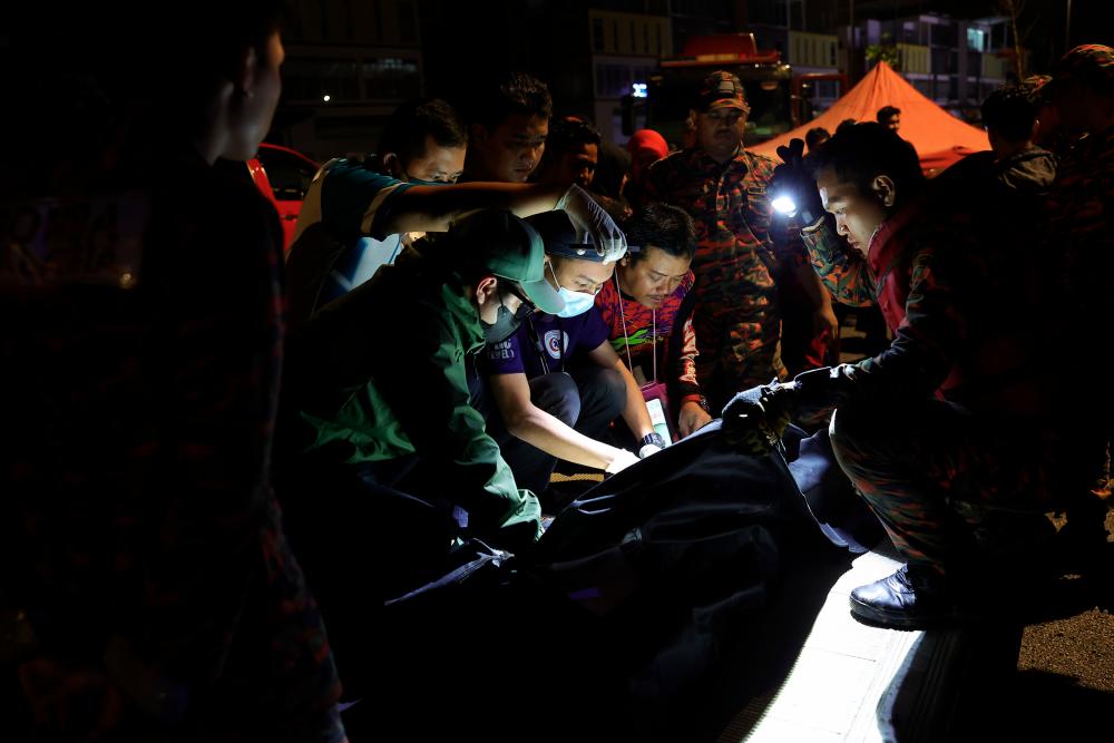 Firemen recover body of child swept away in drain Firemen recover body of child swept away in drain