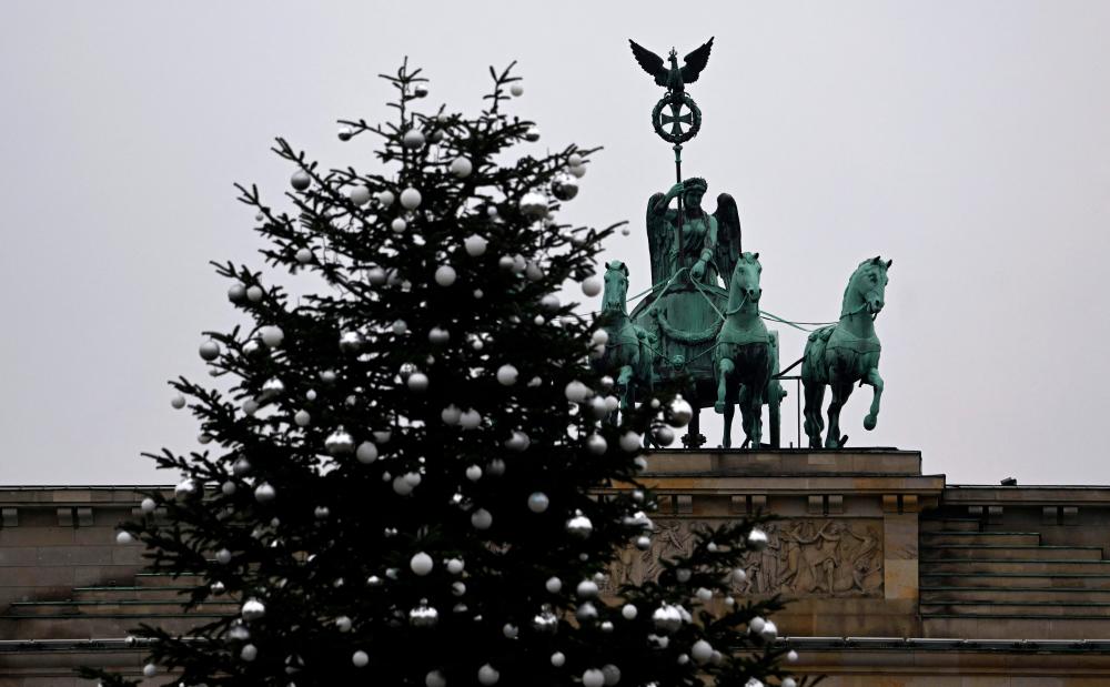 German climate activists cut off top of Christmas tree