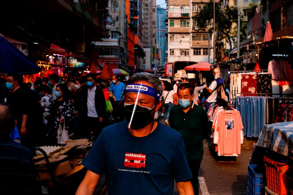 Hong Kong leader says plans to review Covid restrictions on Monday