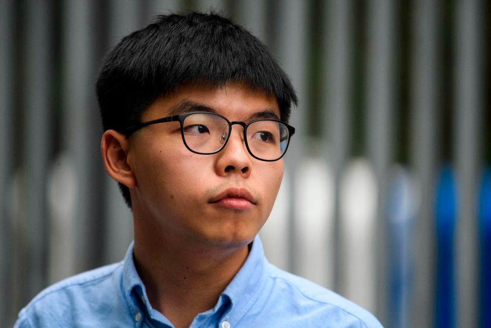 Hong Kong's Joshua Wong handed extra jail time for Tiananmen vigil Hong Kong's Joshua Wong handed extra jail time for Tiananmen vigil