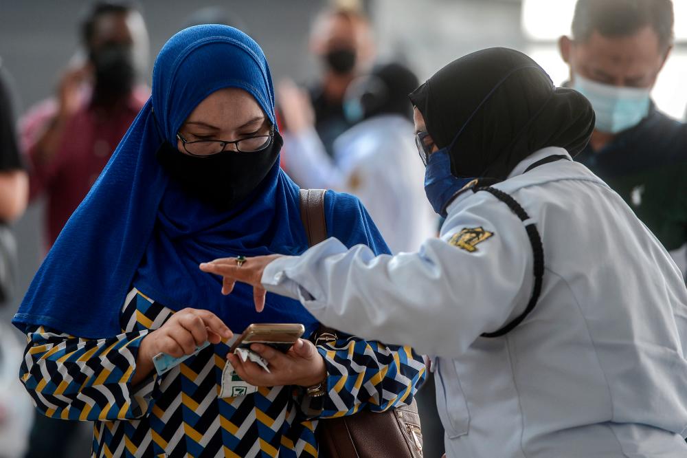 Housewife weeps in court after fined RM9,000 for insulting Agong Housewife weeps in court after fined RM9,000 for insulting Agong