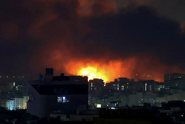 IRAN-ISRAEL-US-WAR-053557_t69abab33_ Israel fires 'broad-scale' strikes on Tehran as war hits 2nd week