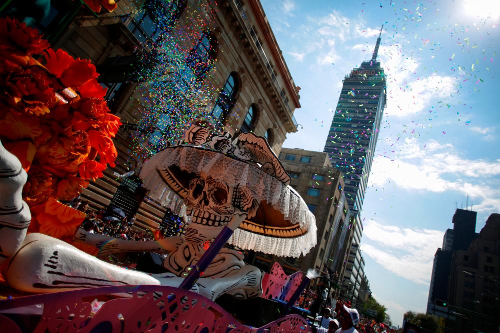 In heart of Mexico City, tourists embrace Day of the Dead celebrations